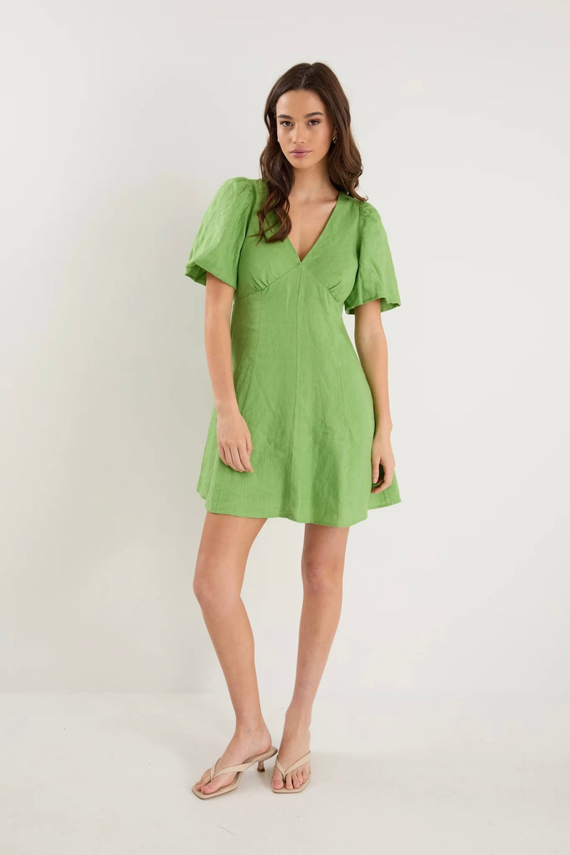 Front view of Adelaide Apple Mini Dress by Among The Brave showing V-neckline and puff sleeves.