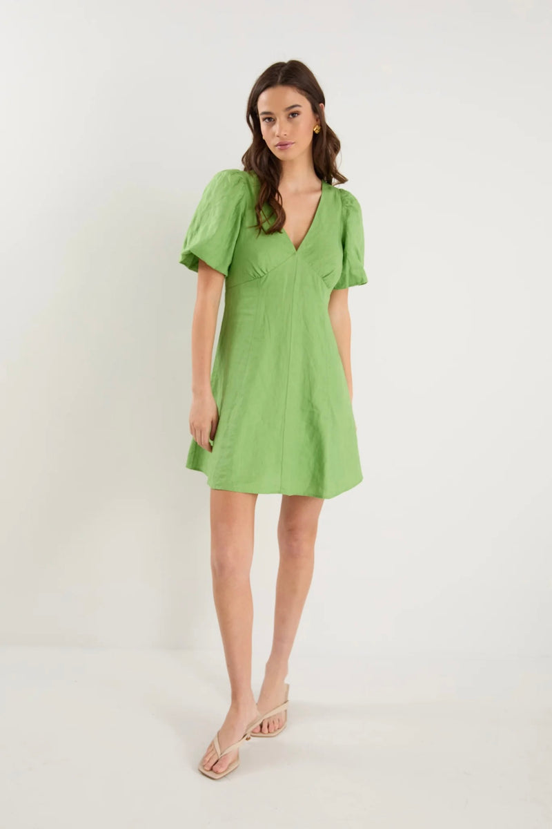 Front view of Adelaide Apple Mini Dress by Among The Brave showing V-neckline and puff sleeves.