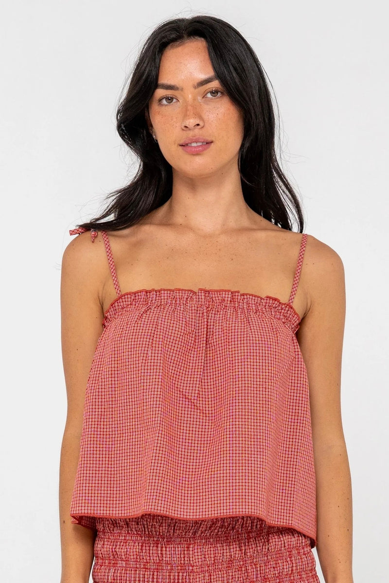 Model wearing red gingham cami top with adjustable tie straps