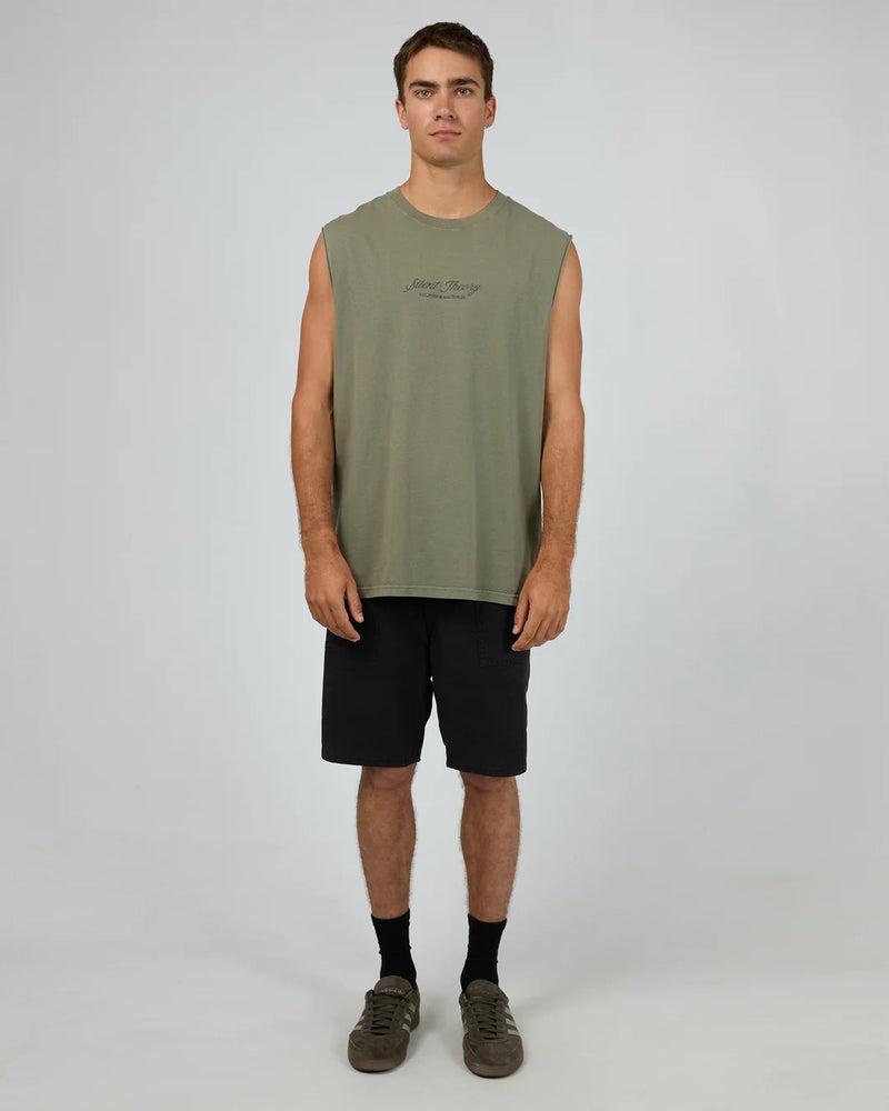 Model wearing Silent Theory Legacy Muscle in olive, featuring sleeveless design and relaxed fit.