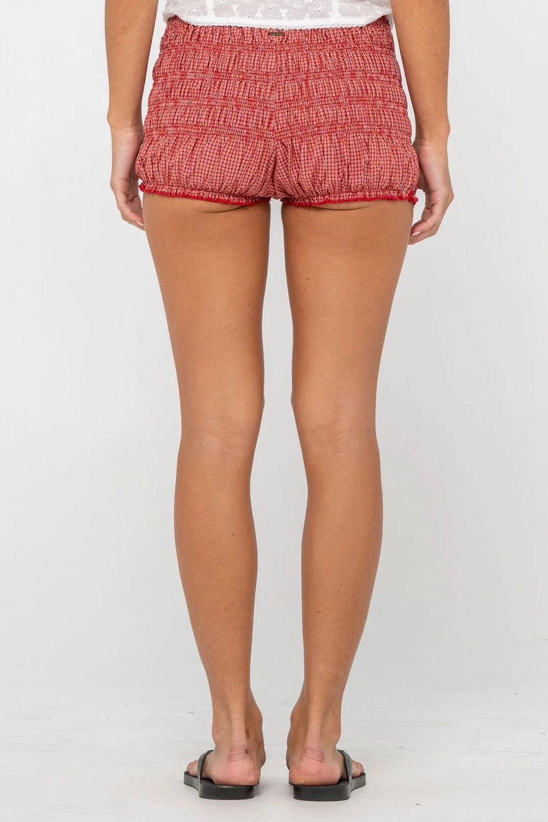 Model wearing red gingham shirred bloomer shorts