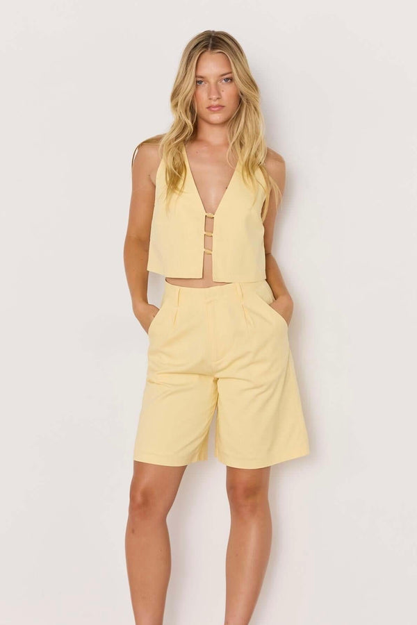 Minkpink Gigi butter yellow linen high-waist Bermuda short, tailored linen shorts women, chic summer outfit, butter yellow linen co-ord set, minimal resort wear clothing
