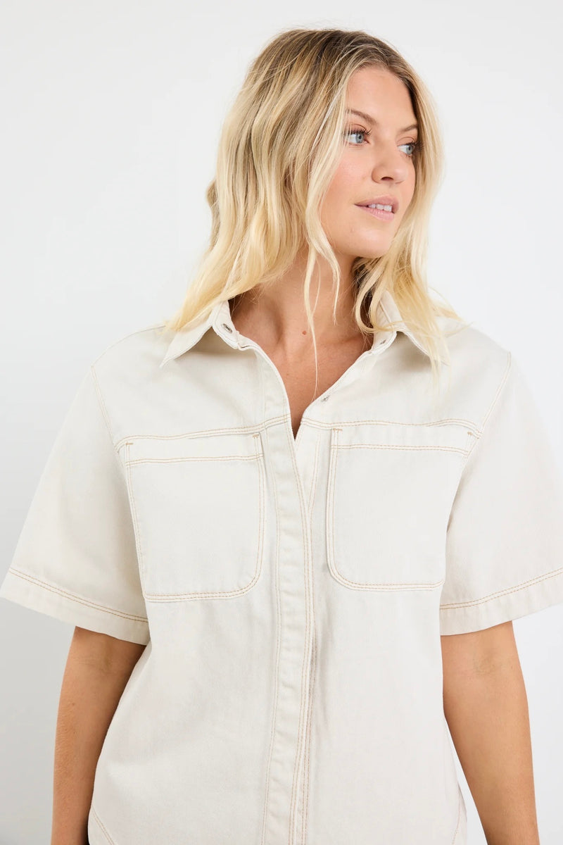 Model wearing ecru short sleeve denim shacket with chest pockets