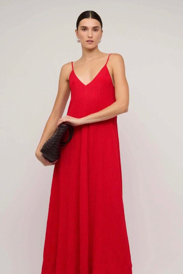 Model wearing Staple The Label Amira Dress in red, maxi length with spaghetti straps
